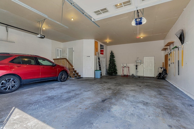1609 26th St SE, Saint Cloud, MN 56304 - garage featuring a garage door opener