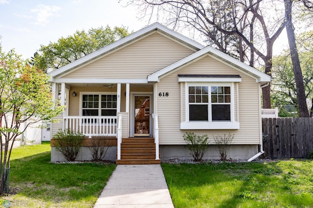 bungalow featuring covered porch and ceiling fan