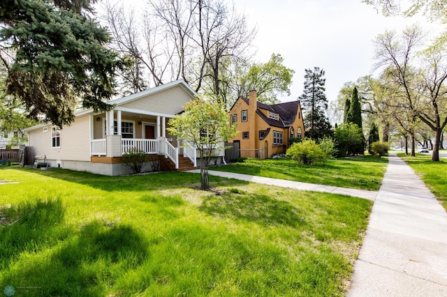 bungalow-style home with a porch and a front yard
