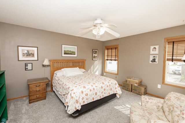 bedroom featuring carpet, baseboards, and ceiling fan