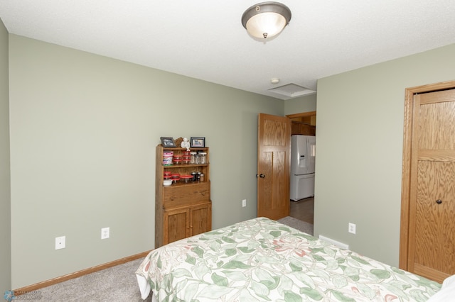 carpeted bedroom featuring white refrigerator with ice dispenser and baseboards