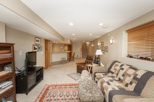 carpeted living room featuring stairs, recessed lighting, and bar