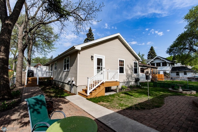 rear view of house featuring a patio