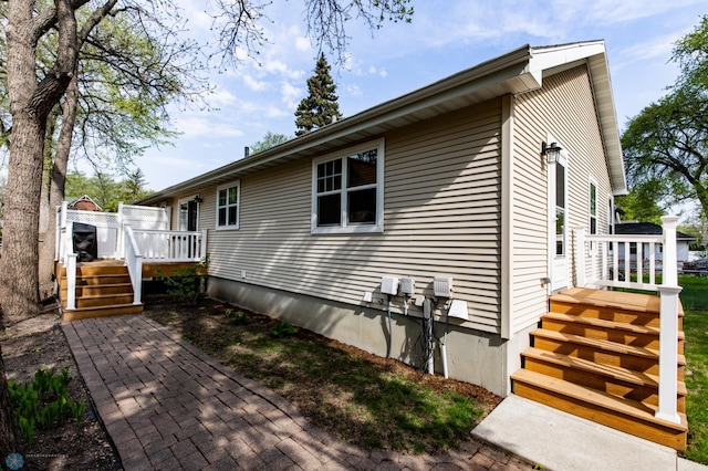 view of home's exterior with a deck