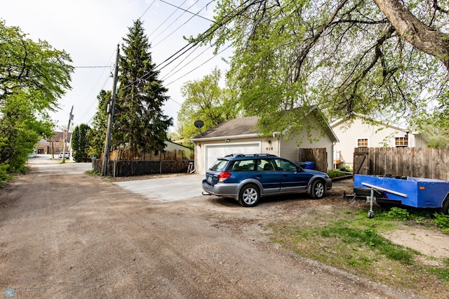view of front of property with fence and driveway