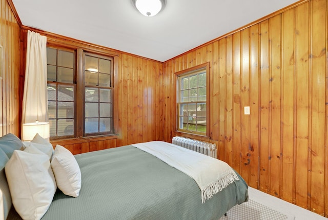 1925 Glenwood Ave, Minneapolis, MN 55405 - bedroom featuring radiator, wood walls, and carpet