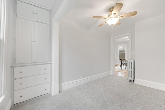1925 Glenwood Ave, Minneapolis, MN 55405 - unfurnished bedroom with carpet, radiator heating unit, baseboards, and a ceiling fan