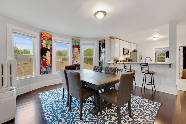 1925 Glenwood Ave, Minneapolis, MN 55405 - dining room featuring dark wood finished floors and baseboards