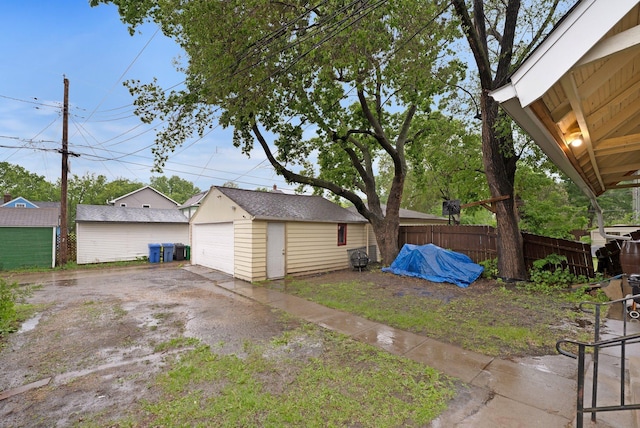 1925 Glenwood Ave, Minneapolis, MN 55405 - view of yard with a detached garage and an outbuilding