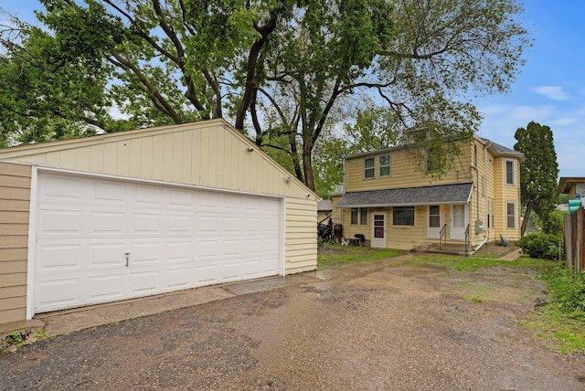 1925 Glenwood Ave, Minneapolis, MN 55405 - view of front facade featuring an outdoor structure and a garage