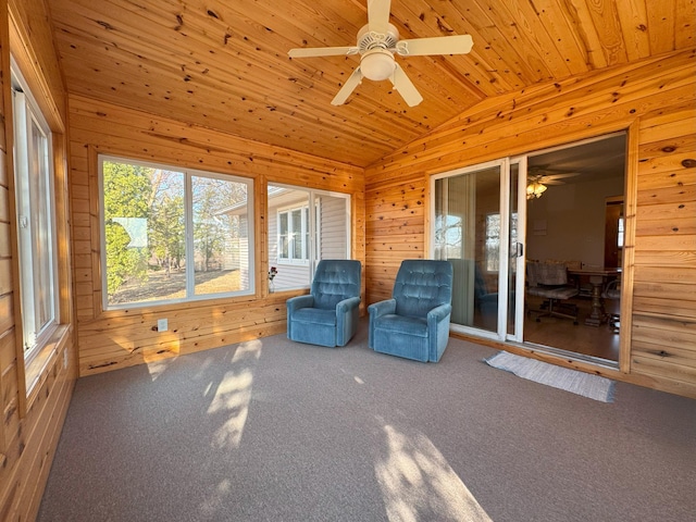 unfurnished sunroom featuring lofted ceiling and ceiling fan