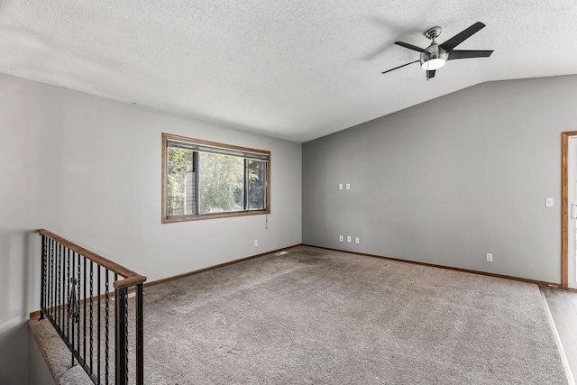 1260 Ferndale St N, Maplewood, MN 55119 - spare room featuring a ceiling fan, carpet flooring, a textured ceiling, baseboards, and lofted ceiling