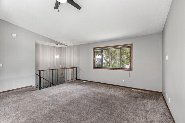 1260 Ferndale St N, Maplewood, MN 55119 - empty room featuring carpet floors, baseboards, a ceiling fan, lofted ceiling, and a smoke detector