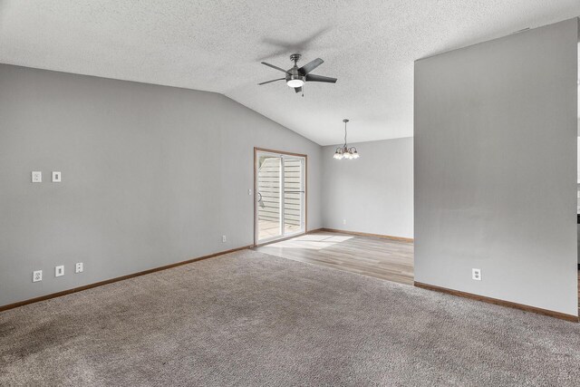 1260 Ferndale St N, Maplewood, MN 55119 - carpeted empty room featuring a ceiling fan, a chandelier, lofted ceiling, baseboards, and a textured ceiling