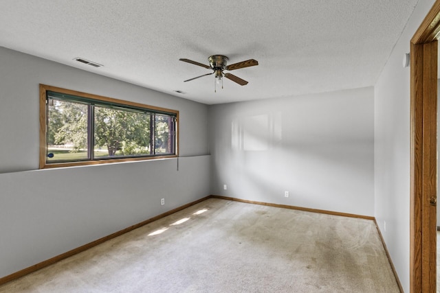 1260 Ferndale St N, Maplewood, MN 55119 - unfurnished room with a ceiling fan, carpet floors, a textured ceiling, and baseboards