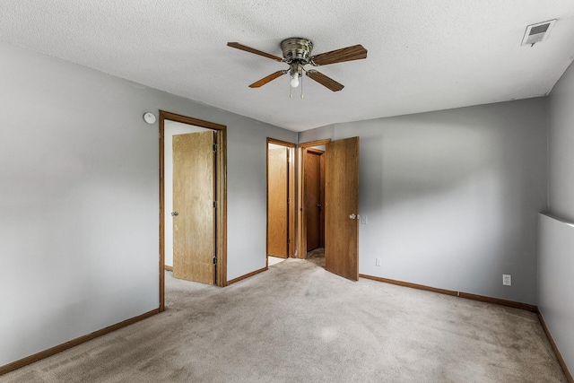 1260 Ferndale St N, Maplewood, MN 55119 - unfurnished bedroom featuring carpet flooring, baseboards, a textured ceiling, and ceiling fan