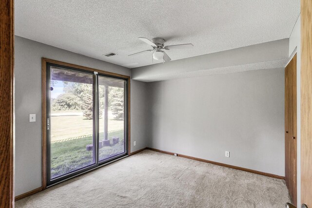 1260 Ferndale St N, Maplewood, MN 55119 - empty room featuring light colored carpet, baseboards, a textured ceiling, and ceiling fan