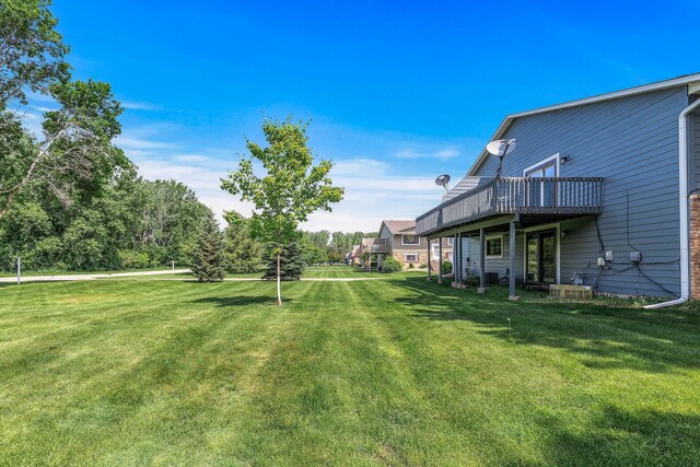 1260 Ferndale St N, Maplewood, MN 55119 - view of grassy yard featuring a deck