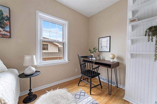 office space featuring wood finished floors and baseboards