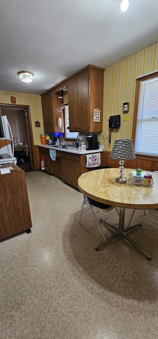 kitchen with wallpapered walls