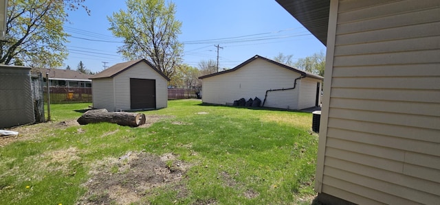 view of yard featuring a shed and an outdoor structure