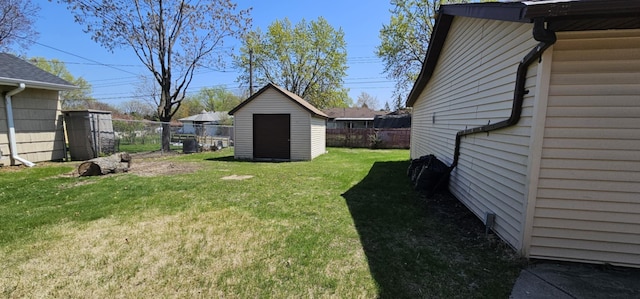 view of yard with a storage shed and an outdoor structure