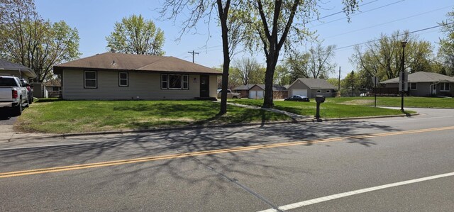 ranch-style house with a front lawn