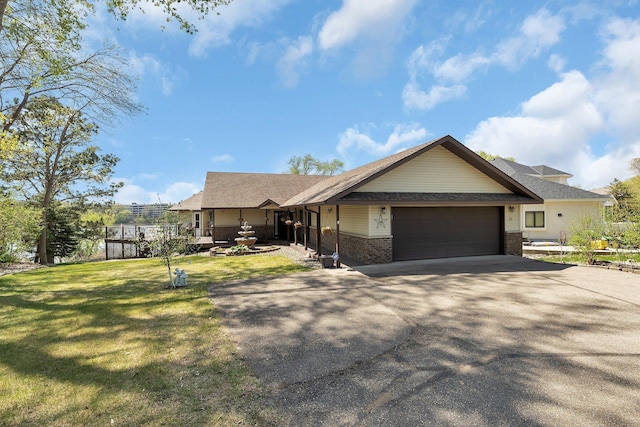 22 13th St S, Sauk Rapids, MN 56379 - ranch-style house with an attached garage, brick siding, driveway, a front yard, and roof with shingles