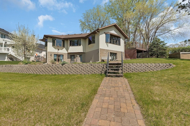 22 13th St S, Sauk Rapids, MN 56379 - view of front of property with stairs, a front yard, and brick siding