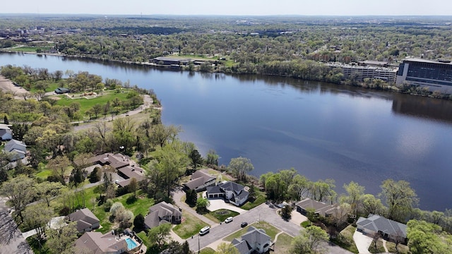 22 13th St S, Sauk Rapids, MN 56379 - aerial view of property and surrounding area with a nearby body of water, a heavily wooded area, and nearby suburban area