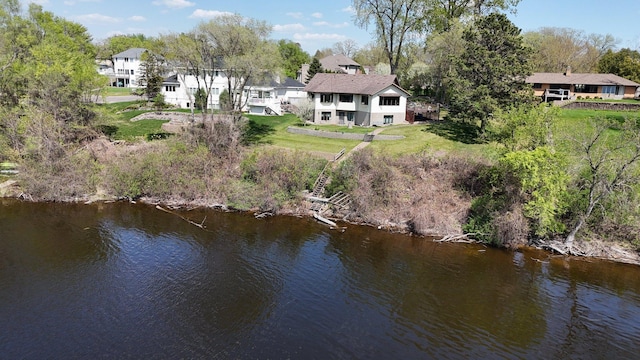 22 13th St S, Sauk Rapids, MN 56379 - rear view of property featuring a water view, a yard, view of scattered trees, and a residential view