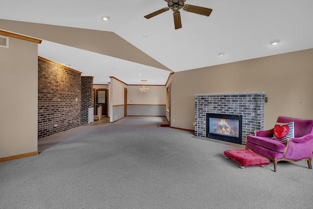 22 13th St S, Sauk Rapids, MN 56379 - carpeted living room featuring a fireplace, lofted ceiling, ceiling fan, baseboards, and a chandelier