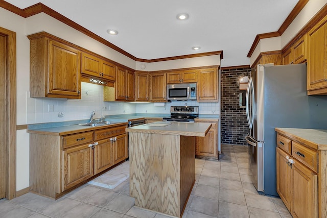 22 13th St S, Sauk Rapids, MN 56379 - kitchen featuring a sink, stainless steel appliances, a center island, crown molding, and light countertops