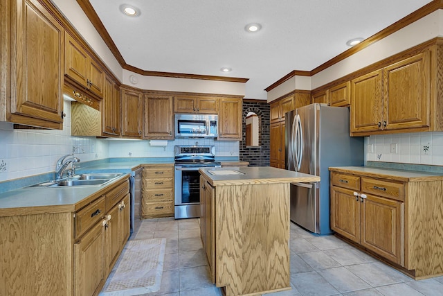 22 13th St S, Sauk Rapids, MN 56379 - kitchen with appliances with stainless steel finishes, a sink, ornamental molding, backsplash, and a kitchen island