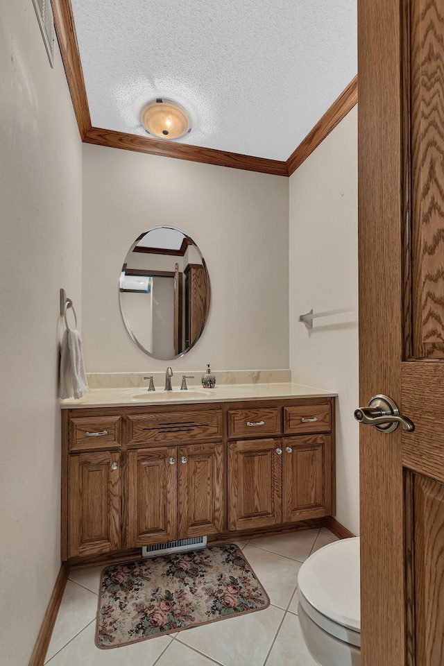 22 13th St S, Sauk Rapids, MN 56379 - bathroom with ornamental molding, vanity, tile patterned floors, toilet, and a textured ceiling