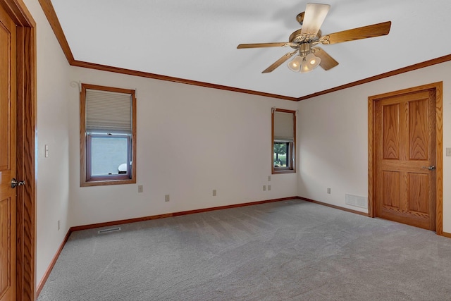 22 13th St S, Sauk Rapids, MN 56379 - carpeted spare room with plenty of natural light, baseboards, crown molding, and ceiling fan