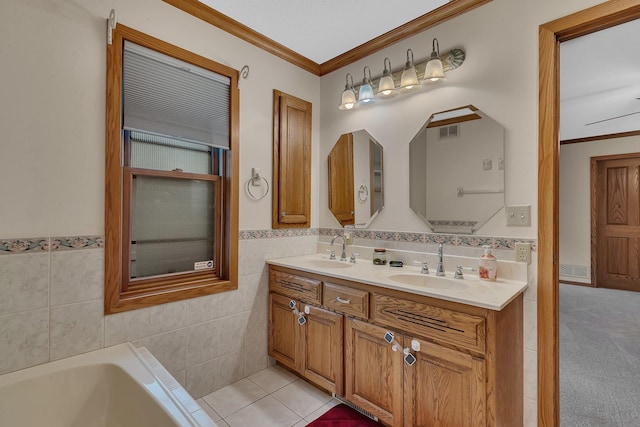 22 13th St S, Sauk Rapids, MN 56379 - full bathroom featuring ornamental molding, double vanity, a tub to relax in, and tile walls