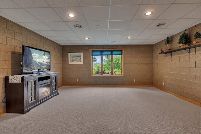22 13th St S, Sauk Rapids, MN 56379 - unfurnished living room featuring carpet flooring, baseboards, a paneled ceiling, a glass covered fireplace, and recessed lighting