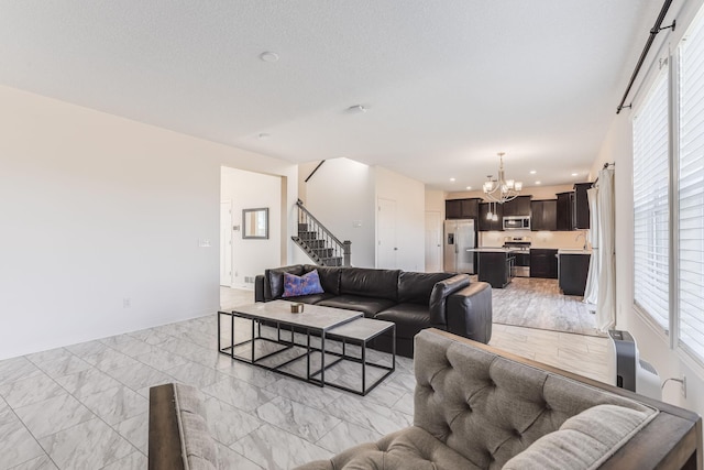 7145 208th Cv N, Forest Lake, MN 55025 - living room with a chandelier, stairs, recessed lighting, and light marble finish flooring