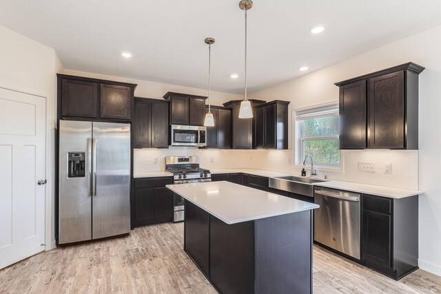 7145 208th Cv N, Forest Lake, MN 55025 - kitchen with stainless steel appliances, a sink, backsplash, light countertops, and recessed lighting