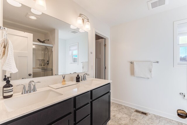 7145 208th Cv N, Forest Lake, MN 55025 - full bathroom with a shower stall, double vanity, plenty of natural light, and baseboards