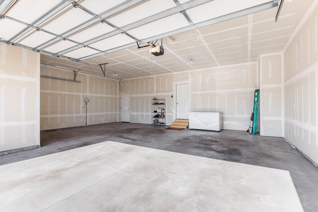 7145 208th Cv N, Forest Lake, MN 55025 - garage featuring refrigerator and a garage door opener