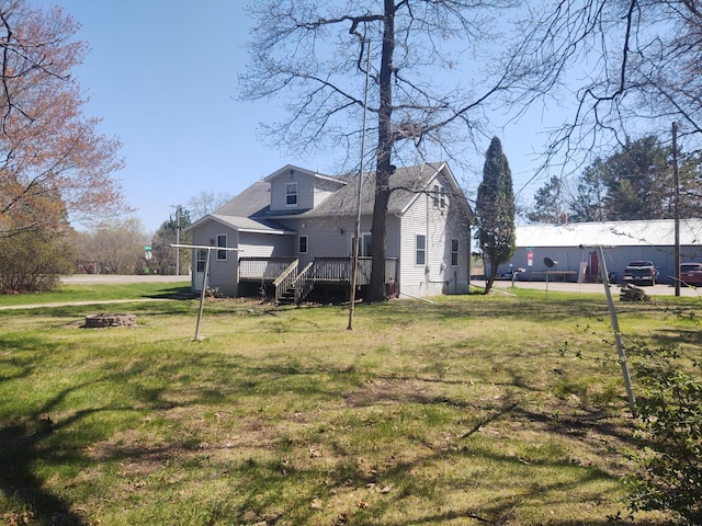 36998 Quest Rd, Hillman, MN 56338 - view of green lawn with a wooden deck