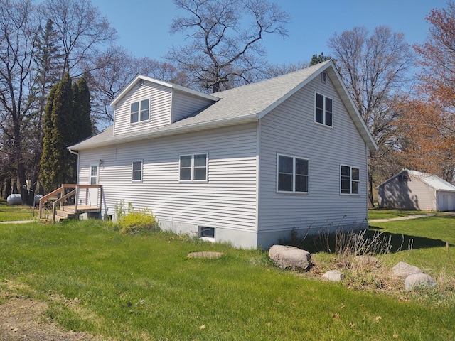 36998 Quest Rd, Hillman, MN 56338 - view of property exterior with a lawn and a shingled roof