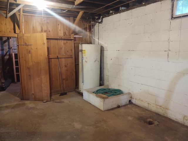 36998 Quest Rd, Hillman, MN 56338 - unfinished basement featuring water heater and concrete block wall