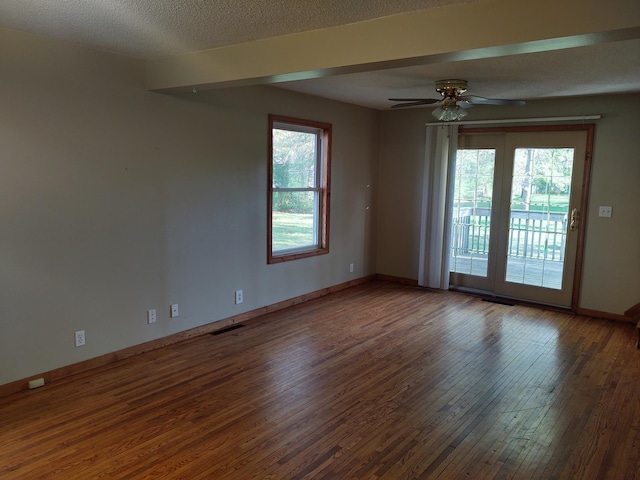 36998 Quest Rd, Hillman, MN 56338 - spare room featuring hardwood / wood-style flooring, ceiling fan, baseboards, and a textured ceiling
