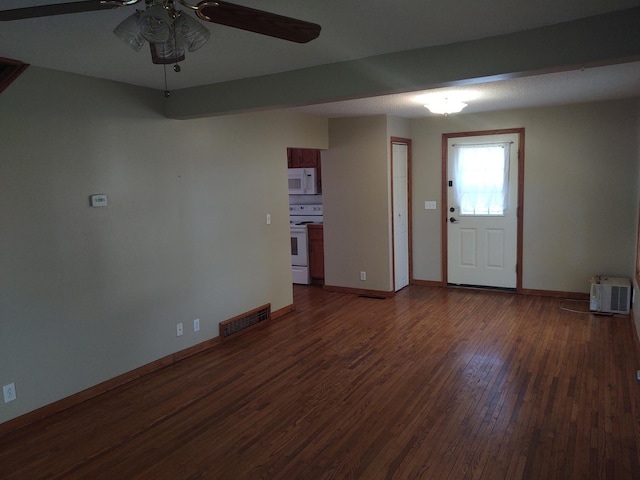 36998 Quest Rd, Hillman, MN 56338 - unfurnished living room featuring dark wood-style floors, ceiling fan, and baseboards