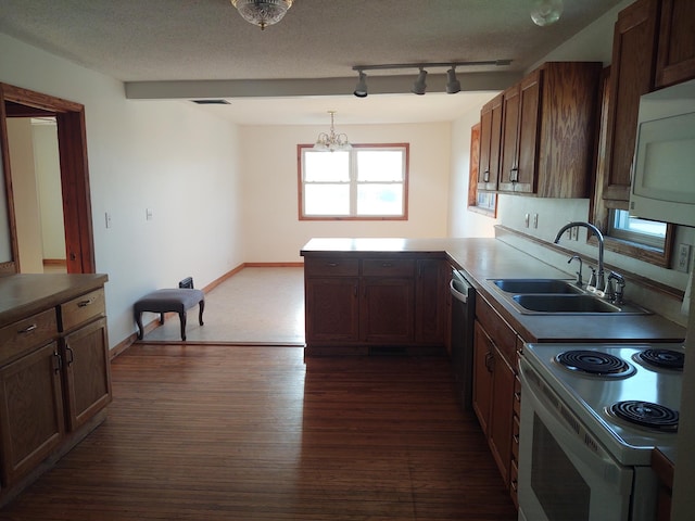 36998 Quest Rd, Hillman, MN 56338 - kitchen featuring a sink, white appliances, a peninsula, dark wood-type flooring, and a chandelier