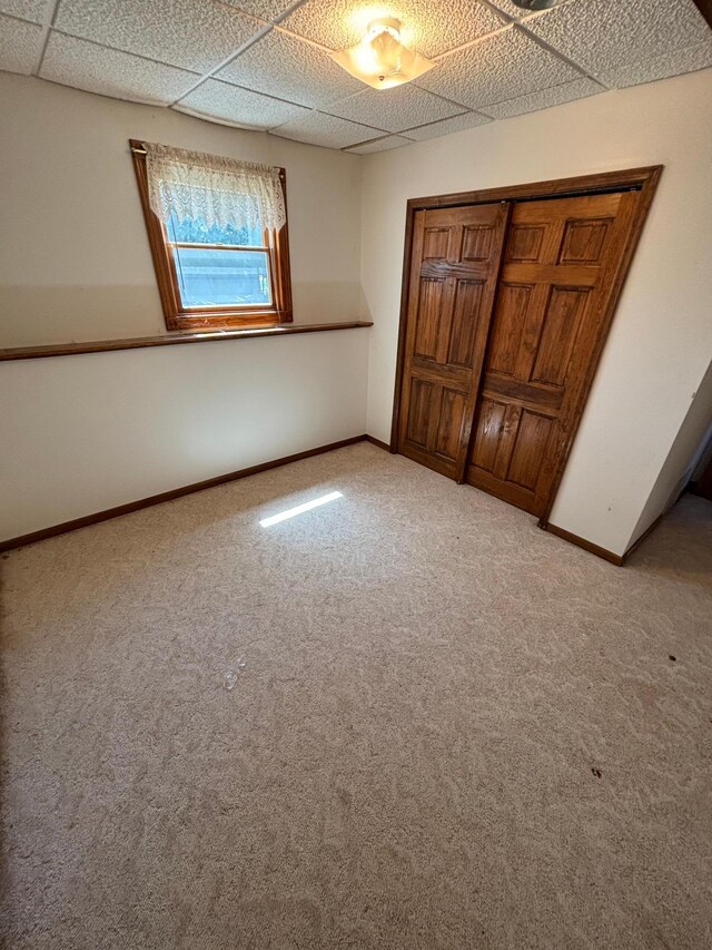 409 4th St NE, Hayfield, MN 55940 - unfurnished bedroom featuring carpet flooring, baseboards, and a closet