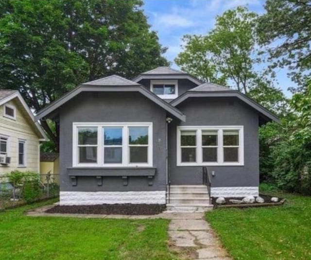 3410 Russell Ave N, Minneapolis, MN 55412 - view of front of house featuring a front yard and stucco siding